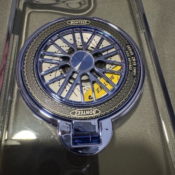 Clear Phone Case with Blue Accents For a 15 Pro Max. Spinning wheel in Center. - Picture 3 of 14